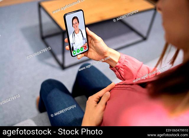 Pregnant Women Doctor Video Call On Phone At Home