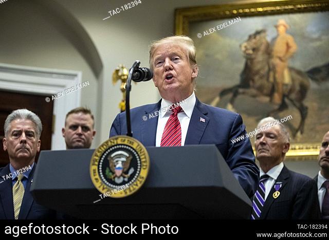 President Donald Trump delivers remarks prior to signing an Executive Order entitled 'National Roadmap to Empower Veterans and End Suicide' in the Roosevelt...