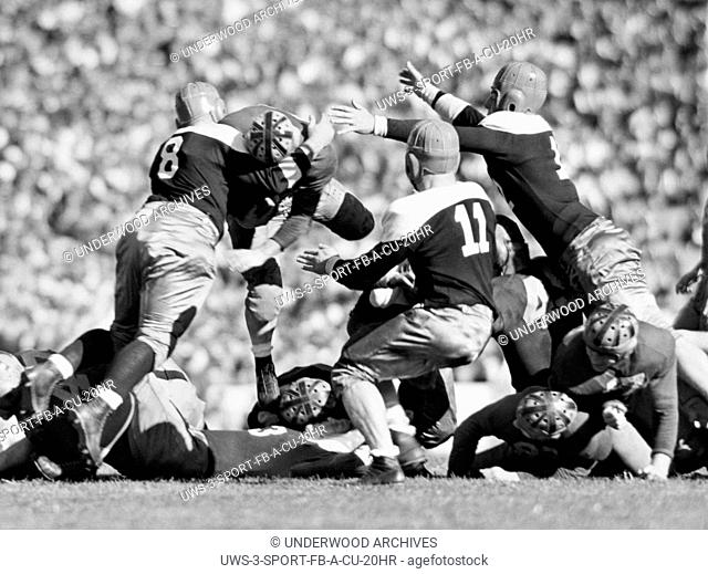 Berkeley, California: October 7, 1939.University of California's Wild Bull halfback, Tony Firpo, is met by three St. Mary's College tacklers as he leaps over...