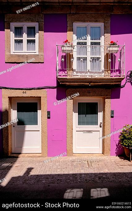 Pink Facade of a Traditional Small House Building with Small Balcony - Viana do Castelo, Portugal