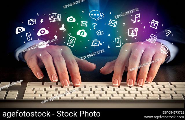 Blogger woman typing on keyboard with drawn application icons around