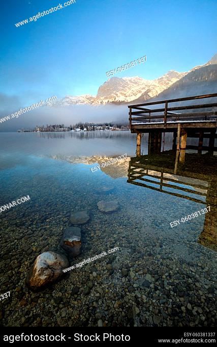 Wooden pier on Lake Grundlsee in Austria during Winter