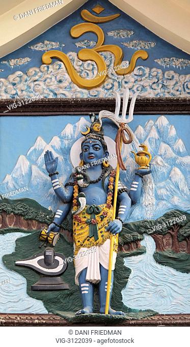 Sculpture of Lord Shiva over the entrance to the Pashupatinath temple complex in Nepal. The complex at Pashupatinath is the holiest Hindu site in Nepal