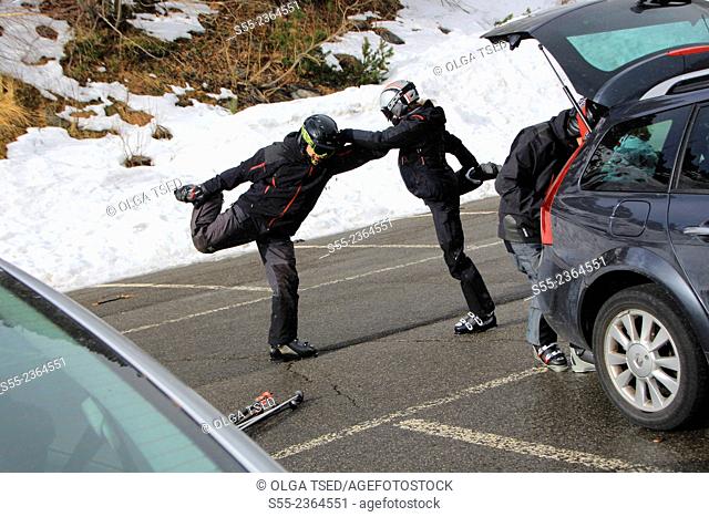 Skiiers doing excercises before skiing. Andorra