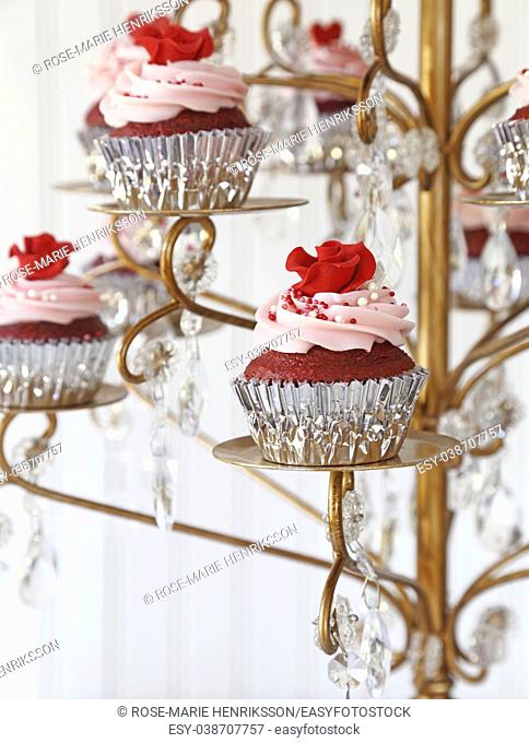 Red Velvet cupcakes displayed on a chandelier