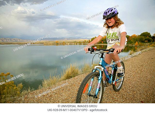 Young Girl 8 Mountain Biking On The Highline Reservoir Dam Near Fruita, Colorado