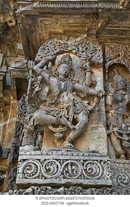 Sculpture of dancing Shiva, west side walls, Hoysaleshwara temple, Halebidu, Karnataka, india. view from West