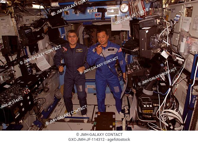 Astronaut Leroy Chiao (right), Expedition 10 commander and NASA ISS science officer, and cosmonaut Salizhan S. Sharipov, flight engineer representing Russia's...