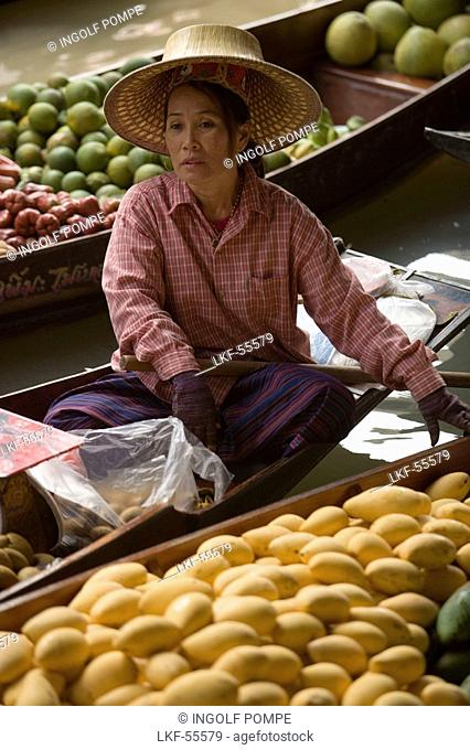Woman offering fruits at Floating Market, Damnoen Saduak, near Bangkok, Ratchaburi, Thailand