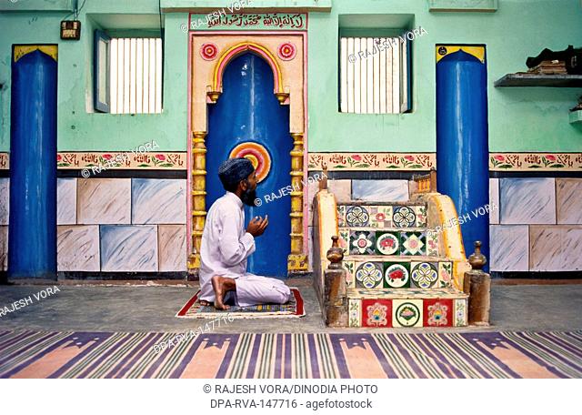 A muslim offering namaz ; worshiping in a mosque Dhangadhra ; Gujarat ; India