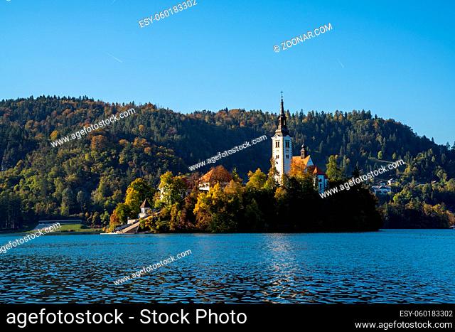 Bled, Slovenia - 18 October, 2021: view of the St. Mary's Church and island on Lake Bled in Slovenia in late autumn
