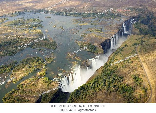 Zimbabwe/Zambia. Aerial view of the Zambezi River and the Victoria Falls (1700m wide). In the foreground the Main Falls (93m high, Zimbabwe)