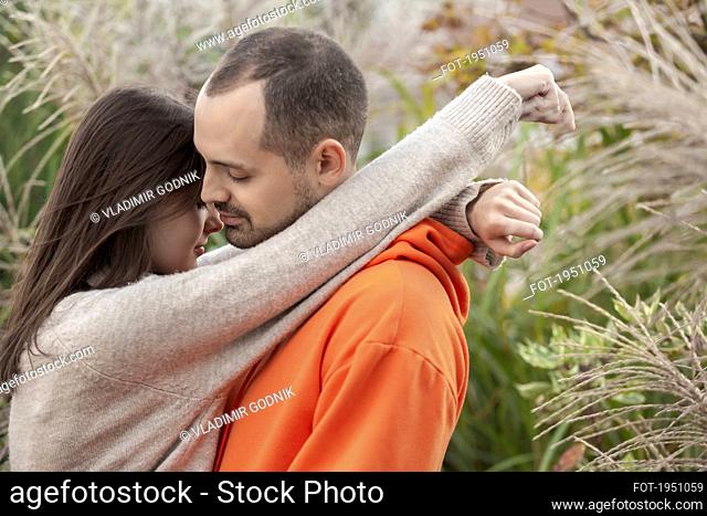 Affectionate, sensual young couple hugging