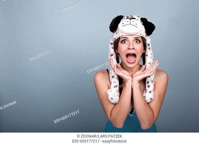 screaming young woman with dog hat