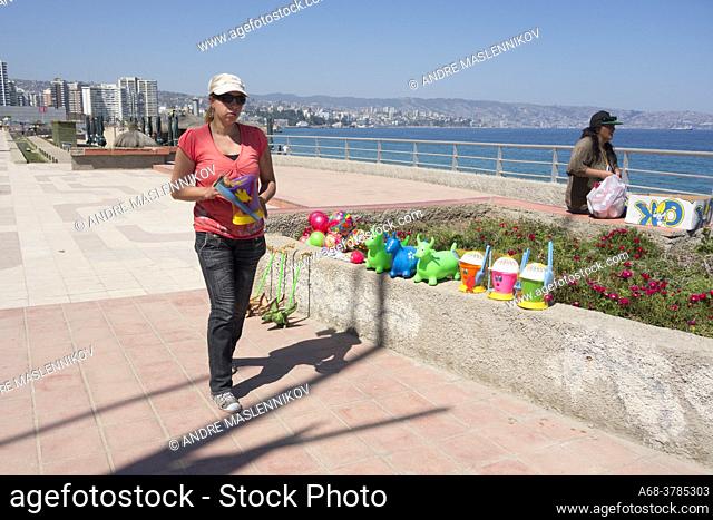 Woman selling toys at Acapulco beach in Vina del Mar. Chile
