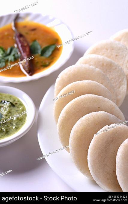 Idli with Sambar and coconut chutney, Indian Dish : south Indian favourite food rava idli or semolina idly or rava idly, served with sambar and green coconut...