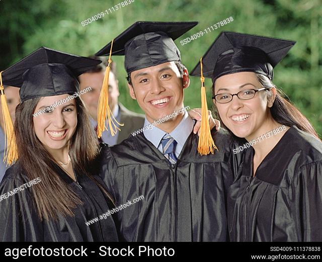 Graduates smiling for the camera
