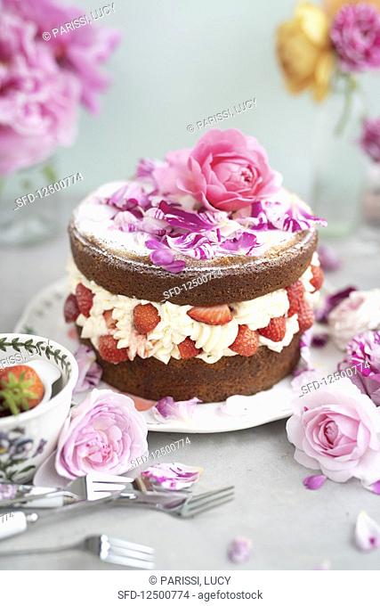 Strawberry rose layer cake filled with whipped cream and strawberries