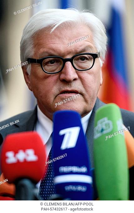 German Foreign Minister Frank-Walter Steinmeier speaks to journalists prior to a meeting of foreign ministers to examine the implementation of the Minsk peace...