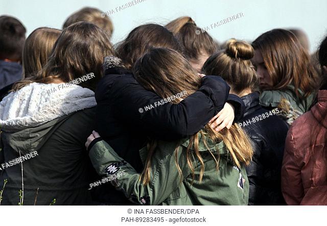 Students hug during a commemoration at the Joseph Koenig secondary school in Haltern am See, Germany, 24 March 2017. On the occasion of the second anniversary...