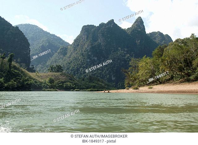 Karst landscape, forested mountains on the Nam Ou River in Muang Ngoi Kao, Luang Prabang province, Laos, Southeast Asia, Asia