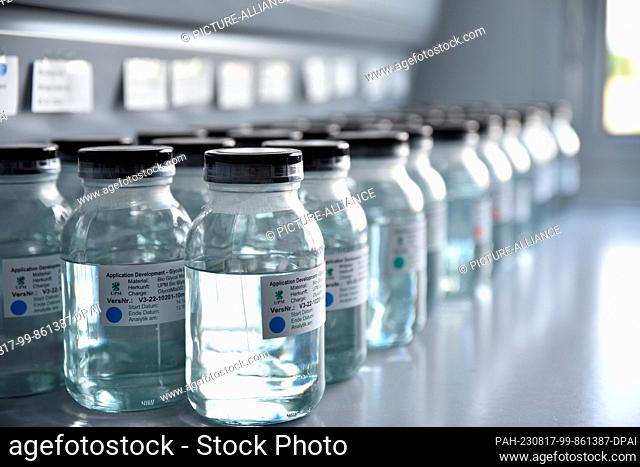 PRODUCTION - 13 July 2023, Leuna: A row of bottles containing glycols stands in the laboratory of the new biorefinery in Leuna