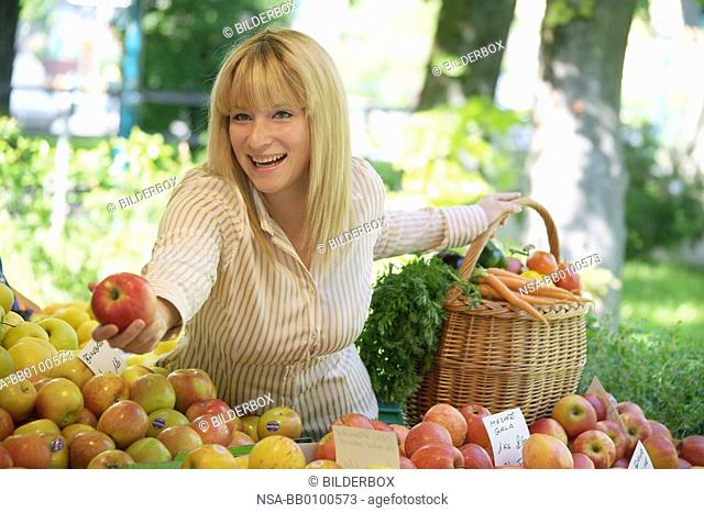Woman on vegetable and fruit market