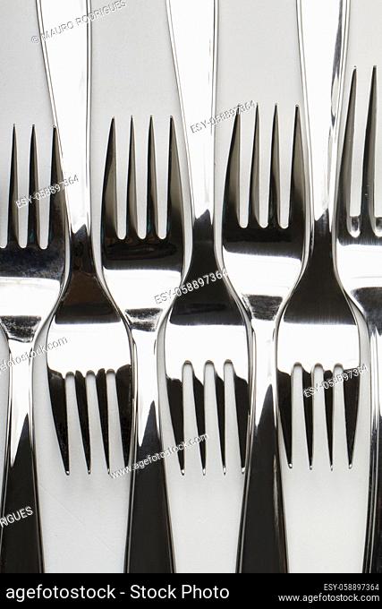 Close up view of kitchen table forks isolated on a white background