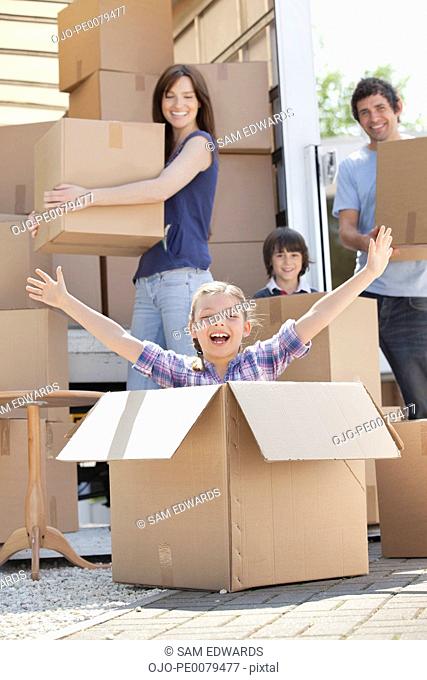 Girl playing in moving box