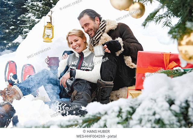 Austria, Salzburg County, Couple celebrating christmas in nature, smiling