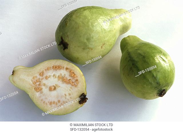 Two whole guavas and half a guava
