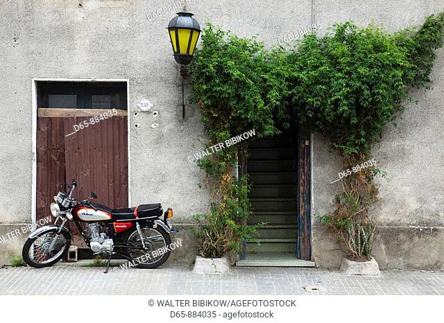 Doorway and motorbike, Colonia del Sacramento, Uruguay