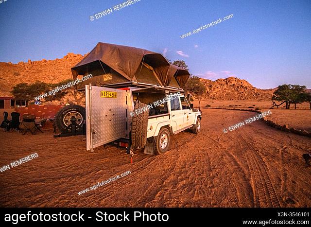 A tent set up on a jeep for camping in the great outdoors , Helmeringhausen, Namibia