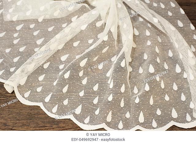 Close up of Beautiful White Tulle. Sheer Curtains Fabric Sample. Texture, Background, Pattern. Wedding Concept. Interior Design