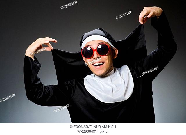 Man wearing nun clothing in funny concept