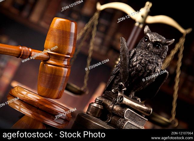 Judge gavel and scales of justice and book background