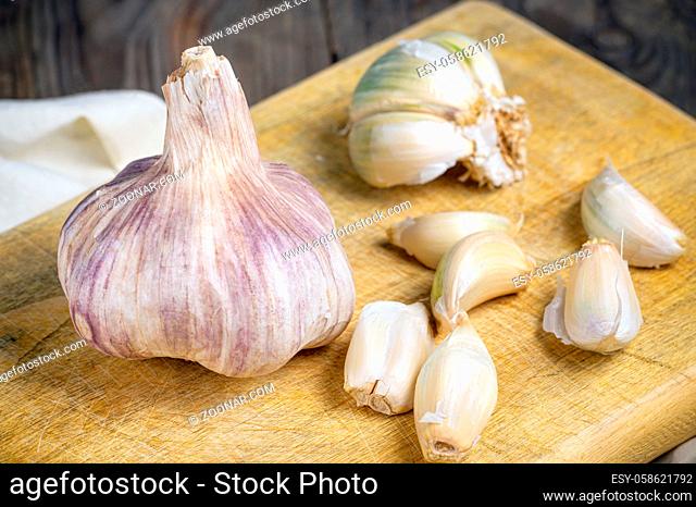 Still life with garlics on rustic wood table
