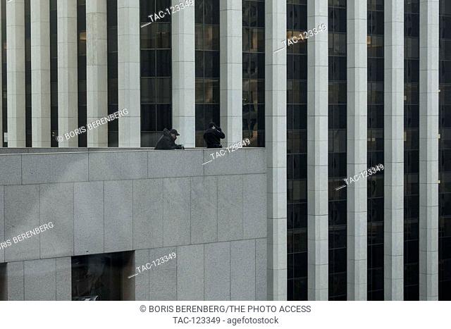 Police snipers overlook the Super Bowl City on Market Street in downtown San Francisco on February 4th, 2016 in San Francisco, California