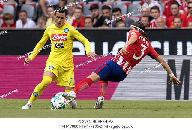 Madrid's Filipe Luis (R) and Napoli's Jose Callejon vie for the ball during the Audi Cup semi-final match pitting Atletico Madrid vs SSC Napoli in the Allianz...