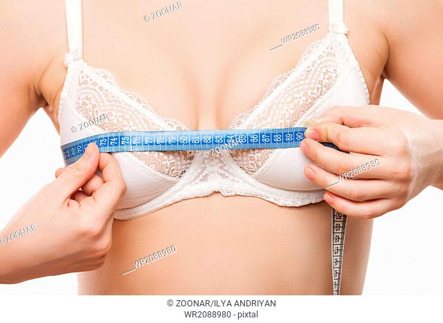 Beauty woman measuring breast growth size