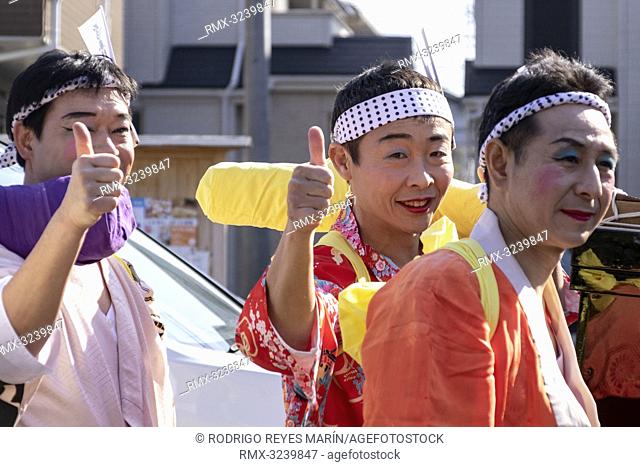 February 24, 2019, Tokyo, Japan - Participants dressed in women's kimonos and wearing makeup, greets to the cameras during the Ikazuchi no Daihannya festival