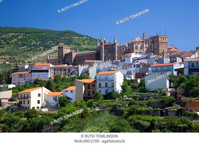 View of the village from valley, the Real Monasterio de Santa Maria de Guadalupe prominent, Guadalupe, Caceres, Extremadura, Spain, Europe