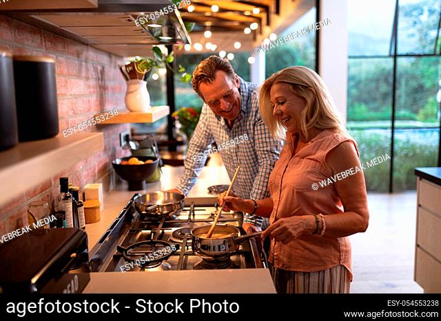 Senior Caucasian couple spending time together in the kitchen