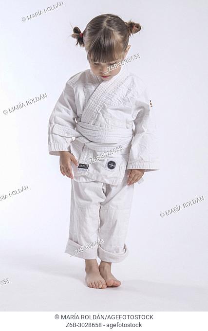 little girl dressed with a judogi