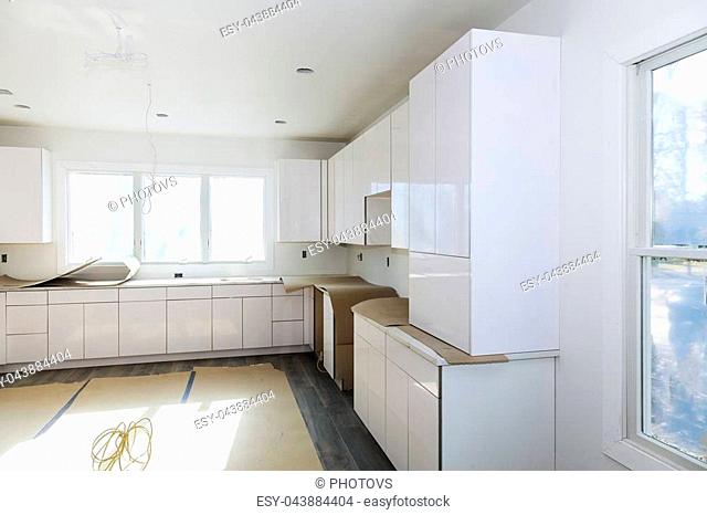 Carpenter Installing New Kitchen Cabinets Stock Photos And Images