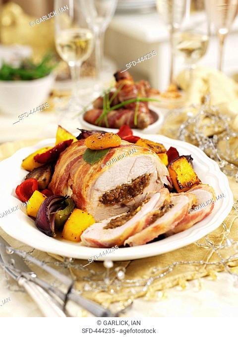 Christmas turkey breast wrapped in bacon with date and plum stuffing