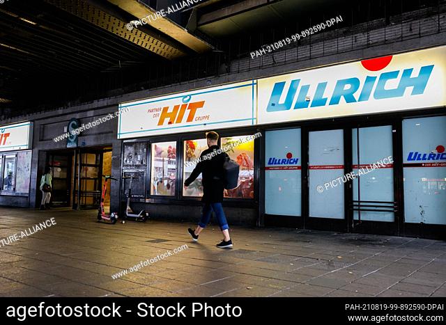 18 August 2021, Berlin: A person walks by the Hit Ullrich convenience store at Zoologischer Garten. Photo: Gerald Matzka/dpa. - Berlin/Berlin/Germany
