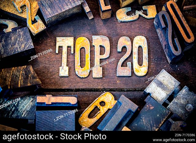 The word TOP 20 written in rusted metal letters surrounded by vintage wooden and metal letterpress type