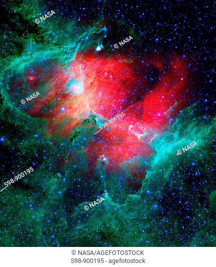 This majestic view, taken by NASA's Spitzer Space Telescope, tells an untold story of life and death in the Eagle Nebula