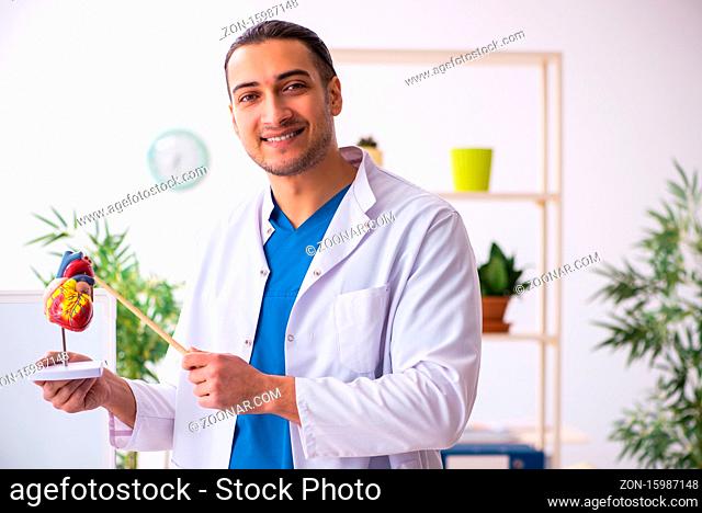 Young doctor in presentation concept